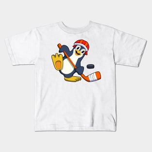 Penguin at Ice hockey with Ice hockey stick & Cap Kids T-Shirt